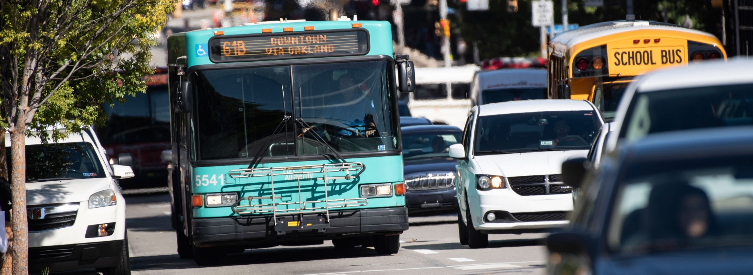 A Pittsburgh Regional Transit bus navigates through city traffic