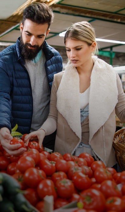 A man and woman shop together 